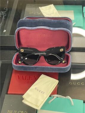 Gucci Black Cat-Eye Sunglasses with Gold Emblems